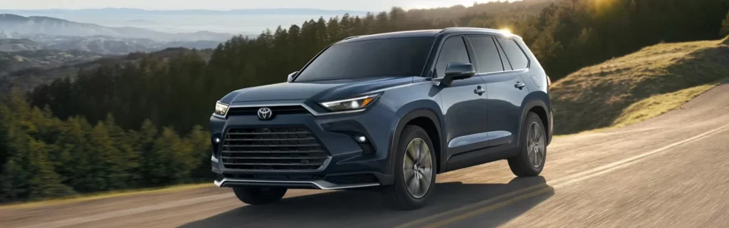 Toyota Grand Highlander SUV driving on a scenic mountain road during sunset
Toyota Grand Highlander showcasing spacious SUV design, refined styling, and adventurous capability