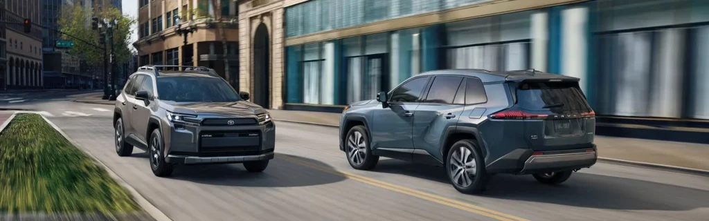 Toyota RAV4 SUVs driving through an urban city street environment
Modern Toyota RAV4 models showcasing bold SUV styling, versatility, and everyday driving capability